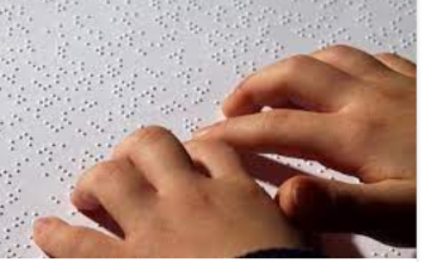 Hands reading braille